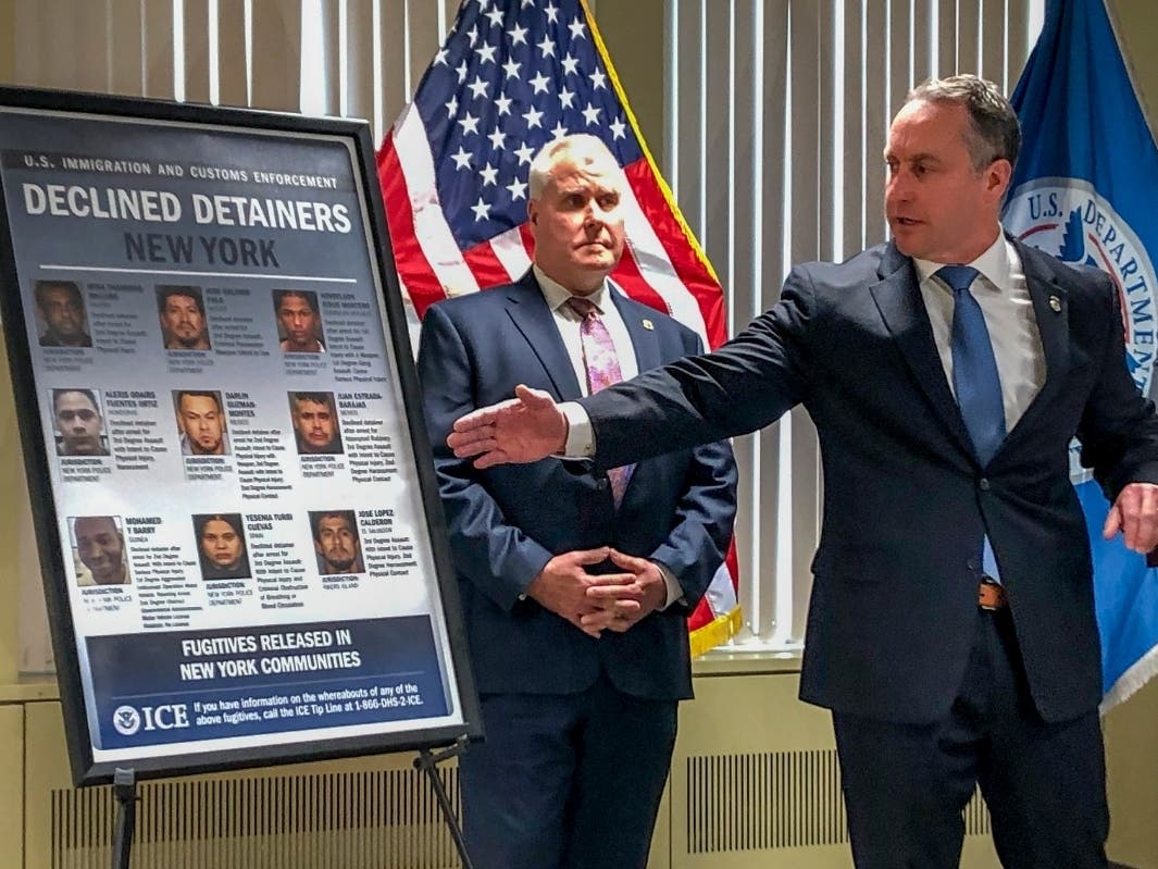 Matthew Albence, right, the acting director of U.S. Immigration and Customs Enforcement, speaks during a news conference, Friday, Jan. 17, 2020.