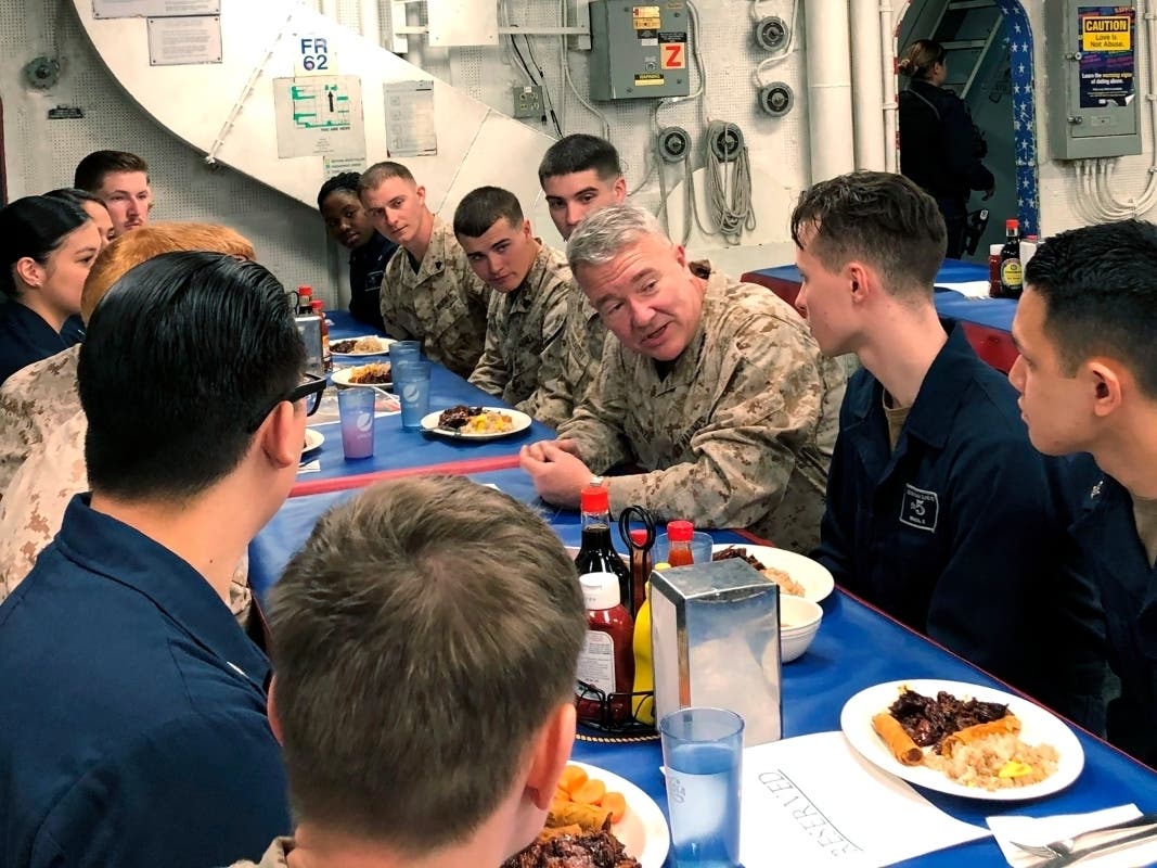 Marine Gen. Frank McKenzie, the top U.S. commander for the Middle East, meets with sailors and Marines on the USS Bataan amphibious assault ship on Thursday in the northern Red Sea. McKenzie told newly arrived troops they may be in the region for a while.