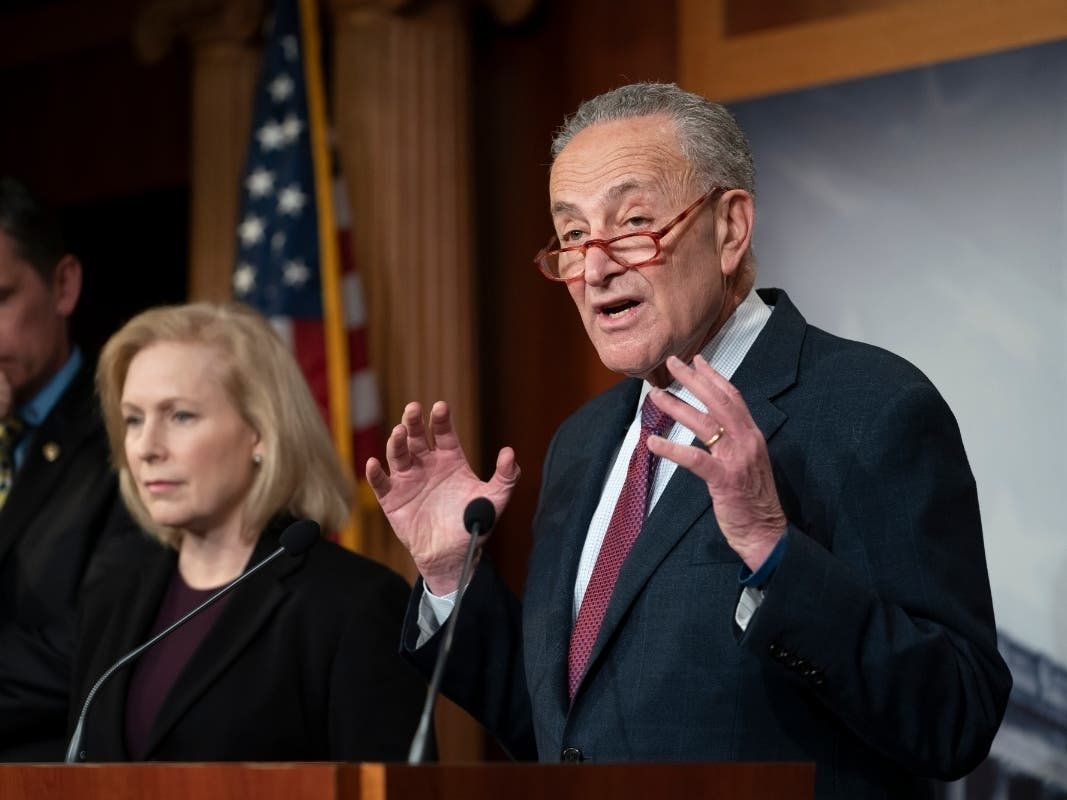 Senate Minority Leader Chuck Schumer, D-N.Y., joined from left by Sen. Martin Heinrich, D-N.M., and Sen. Kirsten Gillibrand, D-N.Y., talks to reporters about the impeachment trial of President Donald Trump in Washington, Friday.