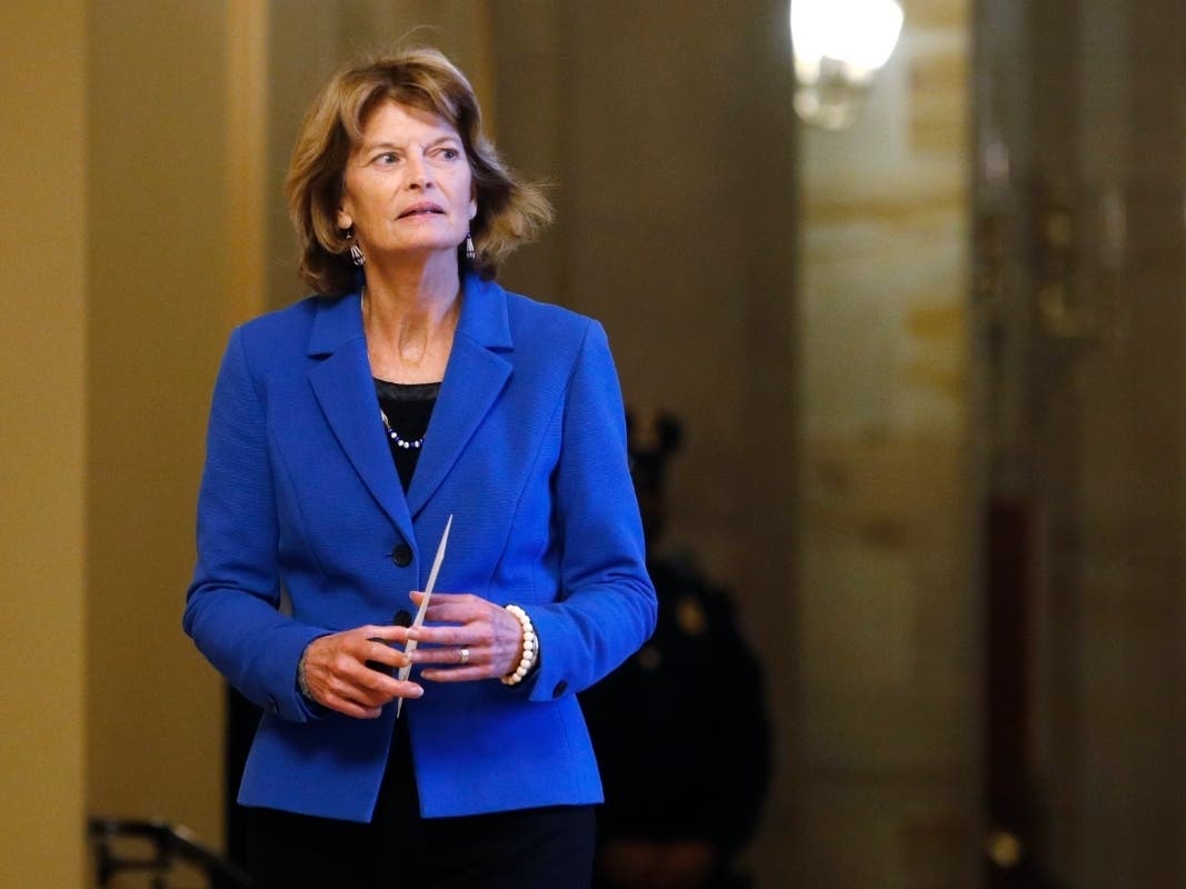 Sen. Lisa Murkowski, R-Alaska, returns to the Senate chamber after a meeting in the Majority Leaders office during a break in the impeachment trial of President Donald Trump.