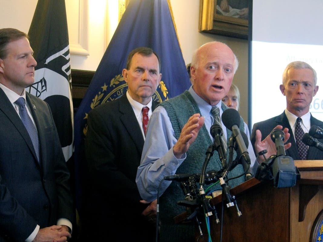 New Hampshire Secretary of State Bill Gardner, second from right, explains the state's efforts to prepare for the upcoming first-in-the-nation presidential primary at a Statehouse news conference.