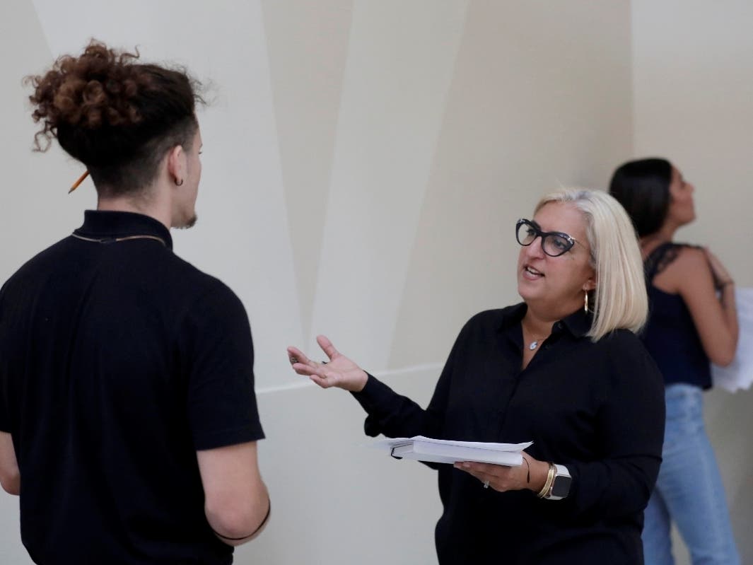 Gory Rodriguez (right) of Starbucks interviews a job applicant during a job fair in October at Dolphin Mall in Miami.