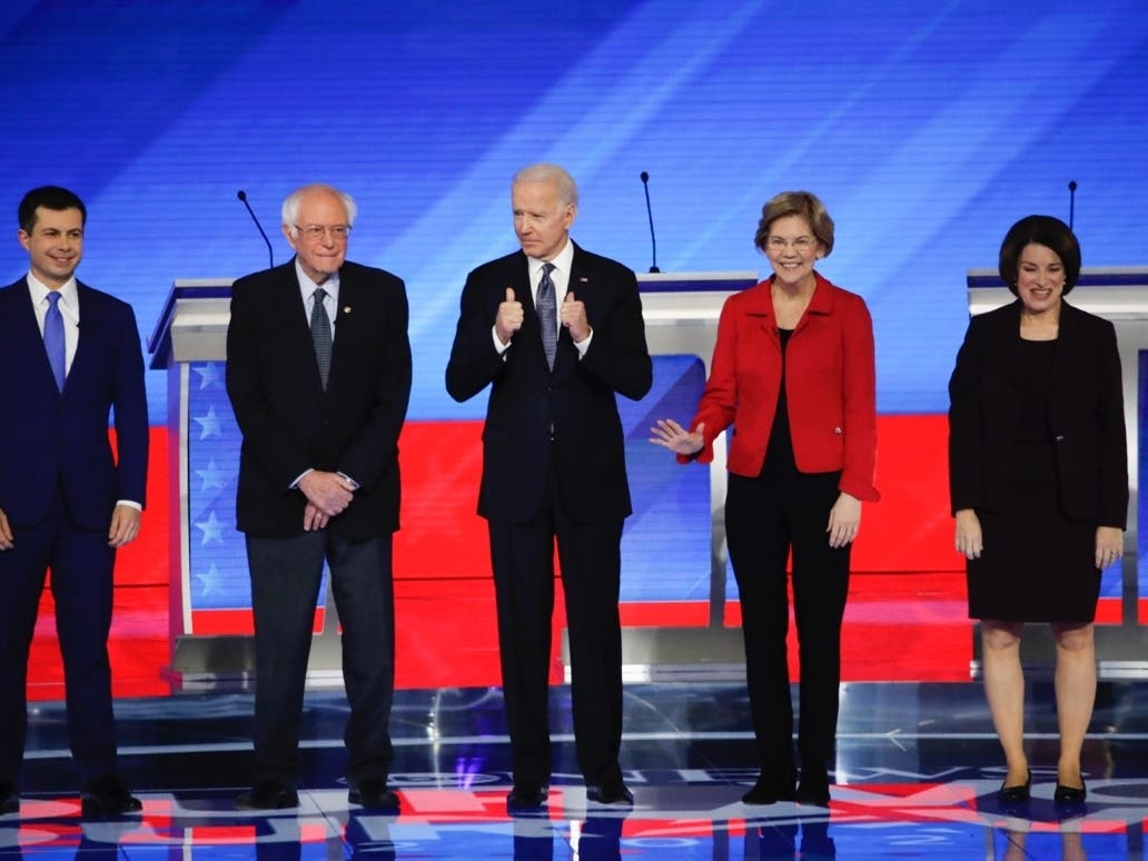 From left, Democratic presidential candidates former South Bend Mayor Pete Buttigieg, Sen. Bernie Sanders, I-Vt., former Vice President Joe Biden, Sen. Elizabeth Warren, D-Mass., and Sen. Amy Klobuchar, D-Minn., stand on stage Friday.