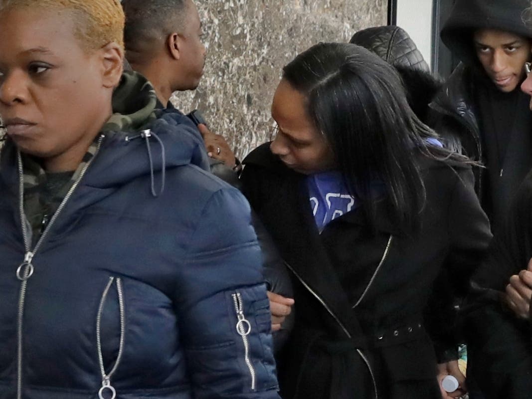 Katima Minton, center, mother of Rashaun Weaver, who has been charged in the December fatal stabbing of 18-year-old Barnard College student Tessa Majors, leaves court in New York after his court appearance.