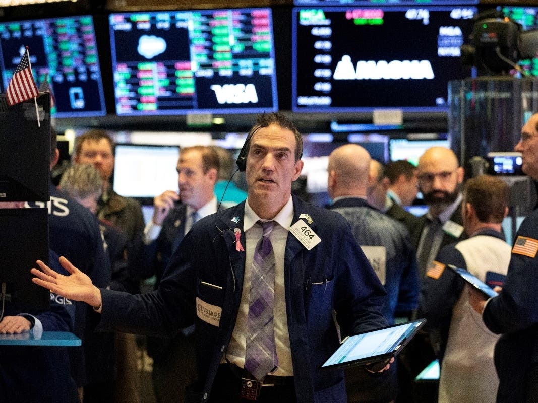 Stock trader Gregory Rowe works Wednesday at the New York Stock Exchange. The S&P 500 has lost more than 10 percent from its record high.