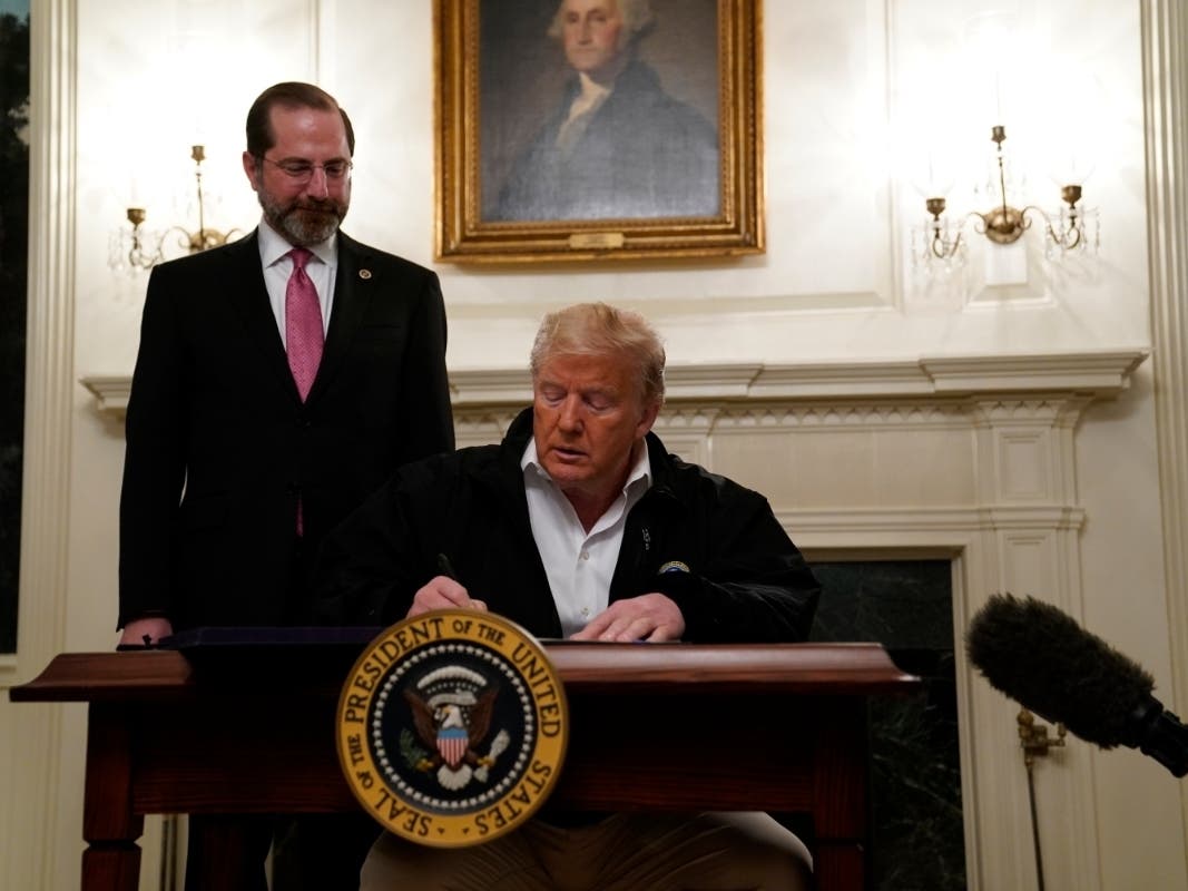 President Donald Trump signs an $8.3 billion bill to fight the coronavirus outbreak in the United States. 