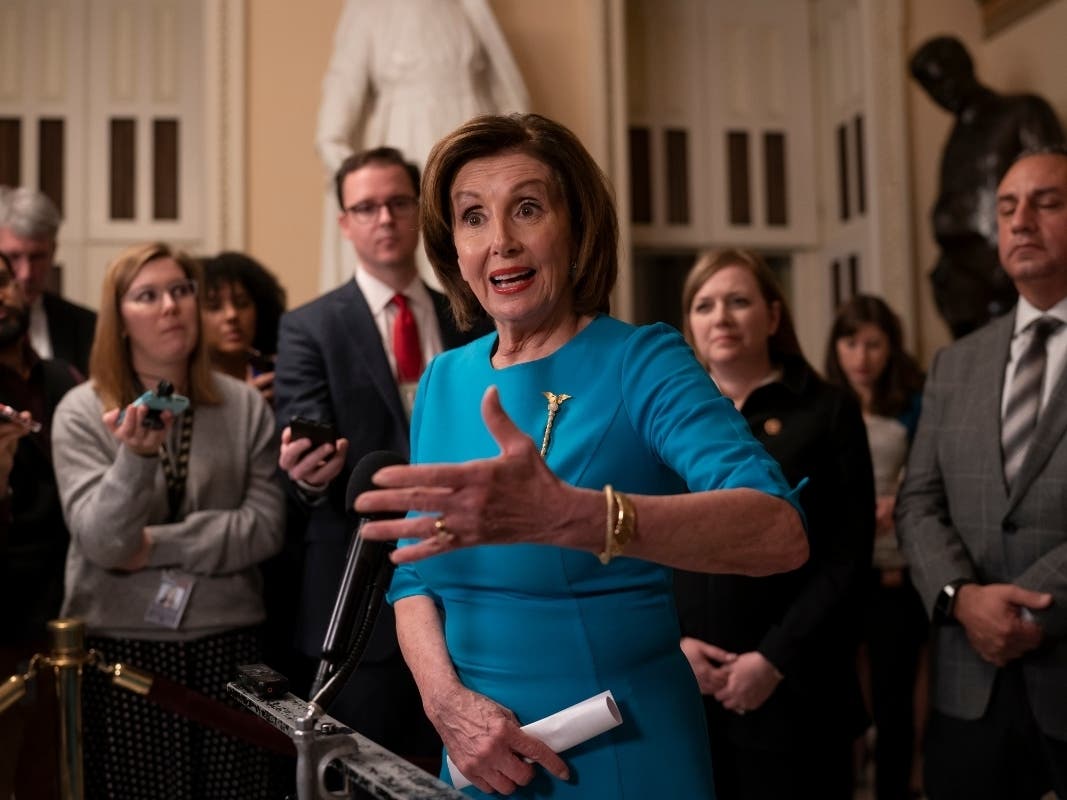 Speaker of the House Nancy Pelosi makes a statement ahead of a planned late-night vote on the coronavirus aid package deal at the Capitol in Washington, D.C.