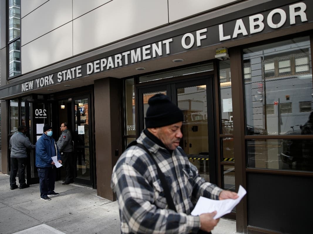 Visitors to the Department of Labor in New York City are turned away Wednesday at the door by personnel due to closures over coronavirus concerns. Applications for jobless benefits are surging in some states as coronavirus concerns shake the U.S. economy.