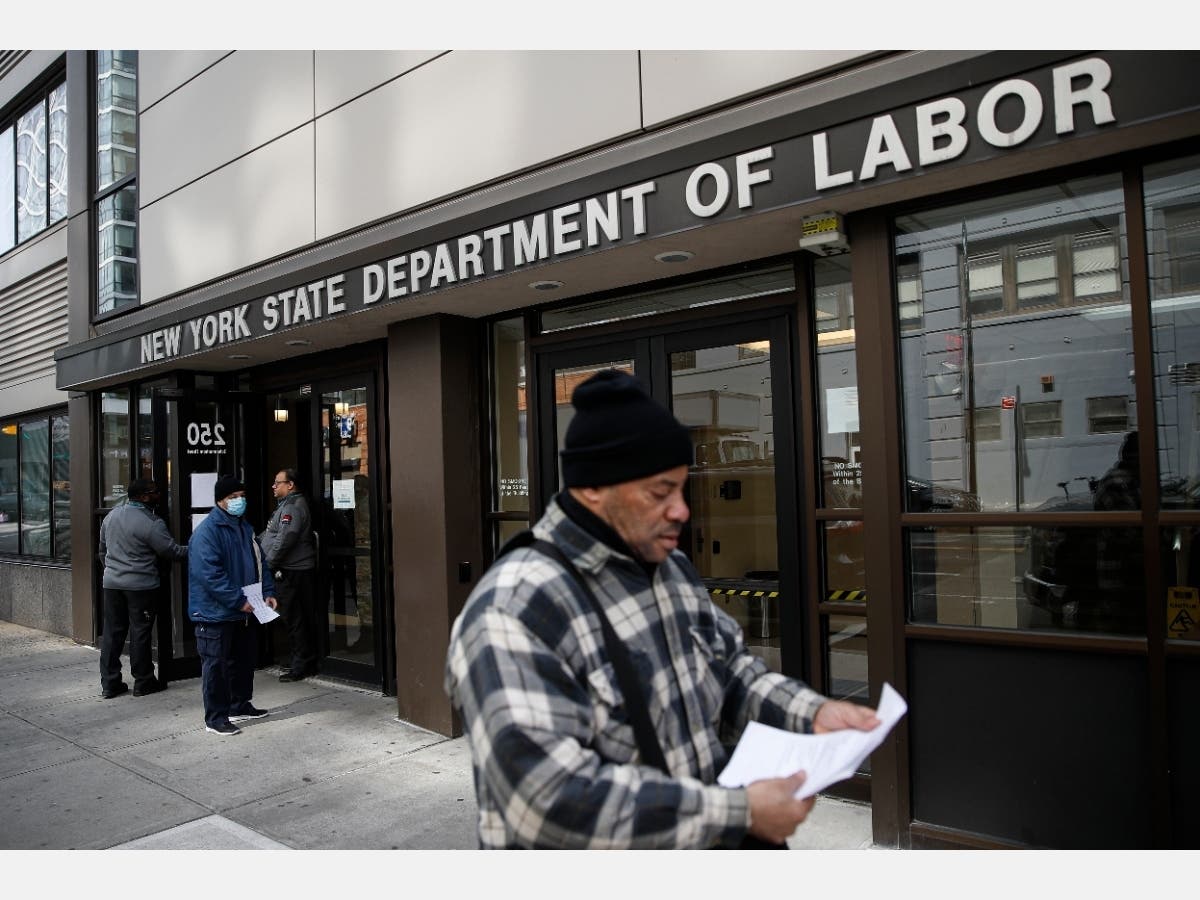 A record-high number of people applied for unemployment benefits last week as layoffs engulfed the United States.