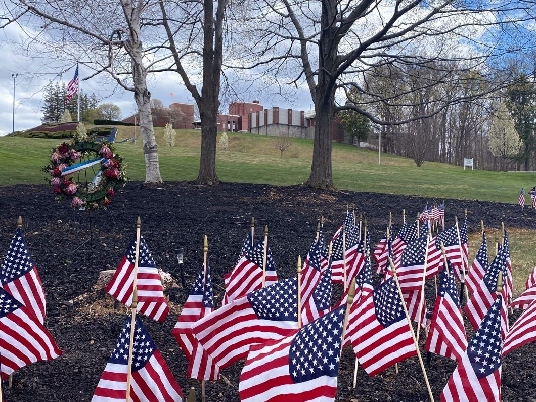 Flags and wreaths honor veterans on the grounds of the Soldiers' Home in Holyoke, where a number of people died due to the coronavirus. 