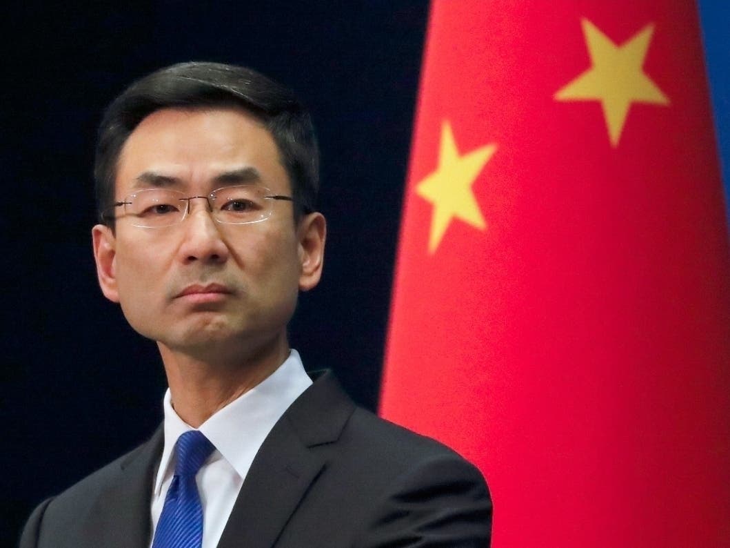 Chinese Foreign Ministry spokesman Geng Shuang listens to a question during a daily briefing at the Ministry of Foreign Affairs office in Beijing.