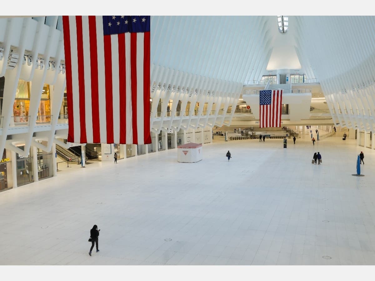 Pedestrians walk through the nearly empty Oculus during the coronavirus pandemic.