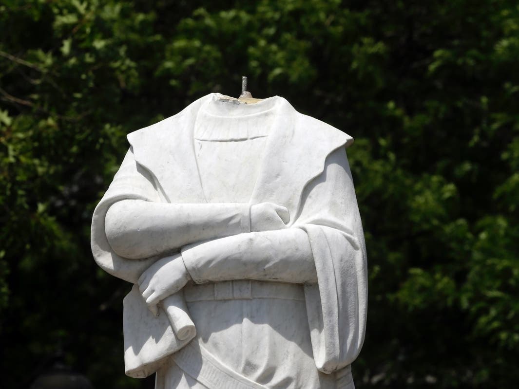 A damaged Christopher Columbus statue stood in a waterfront park the North End.
