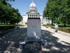 The assault came amid a night of violence Tuesday that included the toppling of two statues outside the Capitol and an attack on a state senator. 