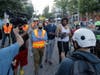 Seattle Department of Transportation workers walk and talk with protest organizers near the Seattle Police Department East Precinct building after SDOT arrived at the the CHOP (Capitol Hill Occupied Protest) zone in Seattle, Friday, June 26, 2020.