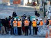 Seattle Department of Transportation workers talk with protest organizers near the Seattle Police Department East Precinct building after SDOT arrived at the the CHOP (Capitol Hill Occupied Protest) zone in Seattle, Friday, June 26, 2020.