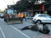 Protesters lie down and sit in the street after workers and heavy equipment from the Seattle Department of Transportation arrived at the the CHOP (Capitol Hill Occupied Protest) zone in Seattle, Friday, June 26, 2020.