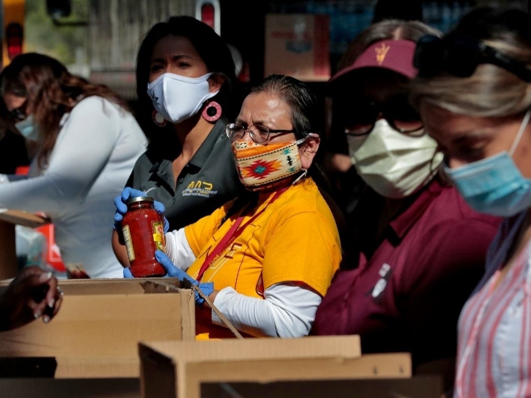 Volunteers prepare donations for delivery to those affected by COVID-19 on Arizona tribal lands.
