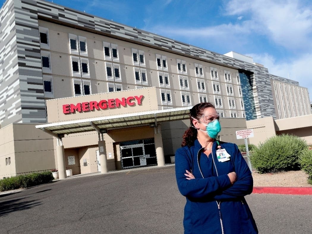 Caroline Maloney stands outside HonorHealth's Scottsdale Osborn Medical Center at the end of her overnight shift early Friday.
