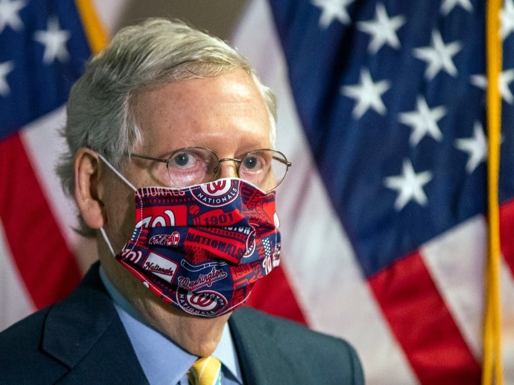 Senate Majority Leader Mitch McConnell listens to questions during a news conference following a GOP policy meeting on Capitol Hill.