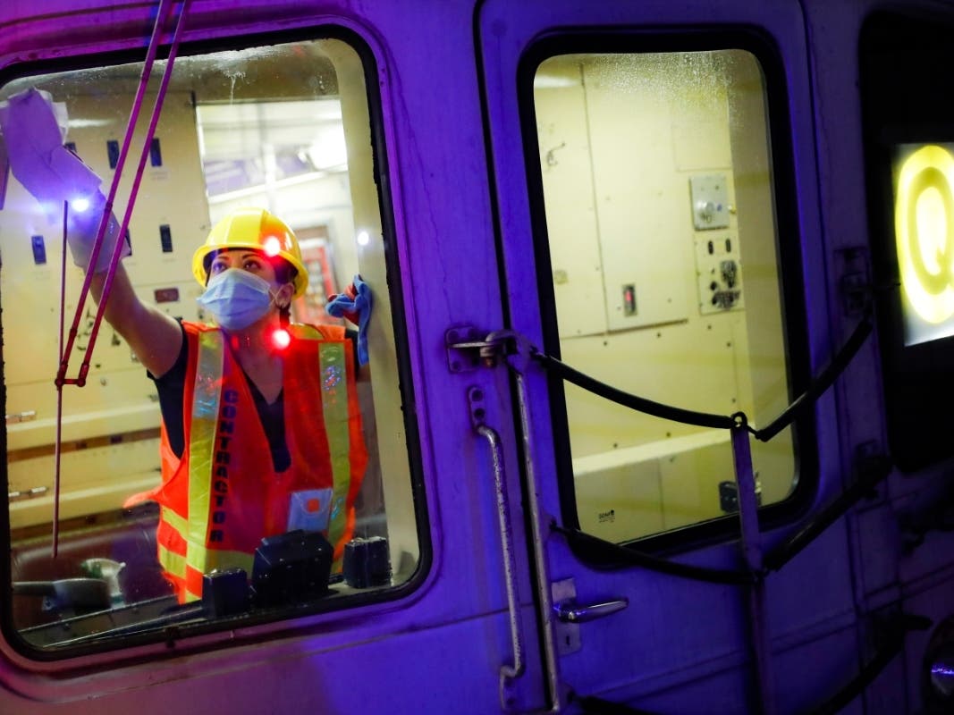 A contractor cleans a subway car at the 96th Street station.