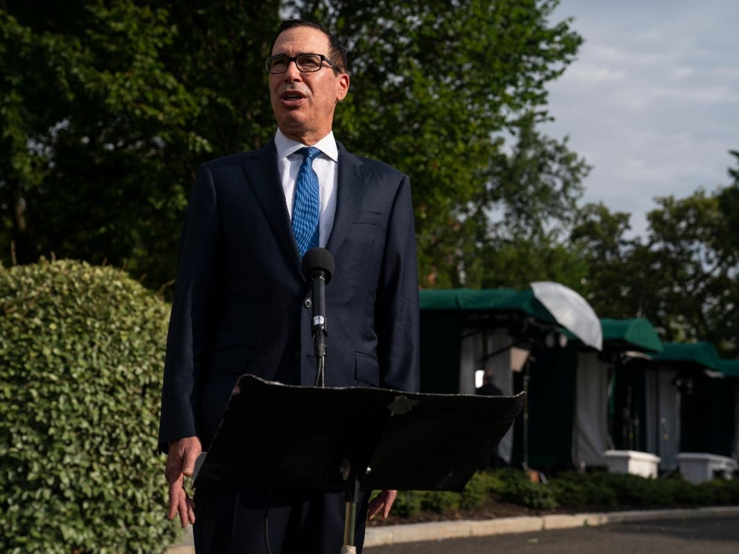Treasury Secretary Steven Mnuchin speaks with reporters about the coronavirus relief package negotiations at the White House on Thursday.
