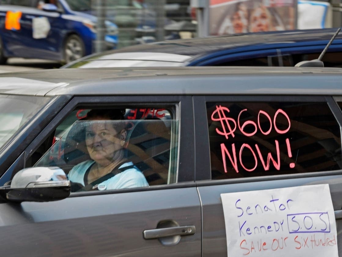 Motorists take part in a caravan protest in front of U.S. Sen. John Kennedy's office at the Hale Boggs Federal Building in New Orleans, Louisiana, asking for the extension of the $600 in unemployment benefits to people out of work due to the coronavirus.