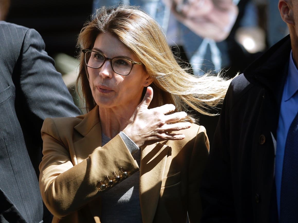 Actress Lori Loughlin arrives at federal court in Boston on Wednesday, April 3, 2019, to face charges in a nationwide college admissions bribery scandal.