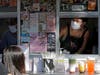 Kaye Fan, right, calls out orders as she works in her Dreamy Drinks food truck, Monday, Aug. 10, 2020, near the suburb of Lynnwood, Wash., north of Seattle.