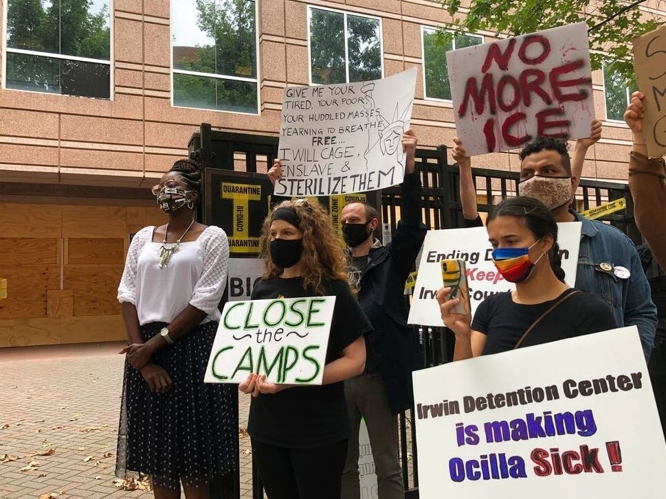 Dawn Wooten, left, a nurse at Irwin County Detention Center in Ocilla, Georgia, speaks at a news conference in Atlanta protesting conditions at the immigration jail. 