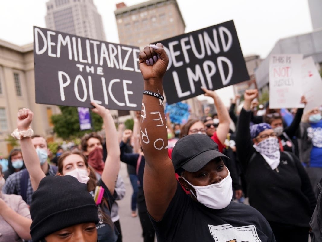 Protesters speak, Wednesday, Sept. 23, 2020, in Louisville, Ky. A grand jury has indicted one officer on criminal charges six months after Breonna Taylor was fatally shot by police in Kentucky. 