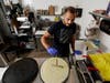 New U.S. citizen Jad "Jay" Jawad, owner of the Crepe House Cafe, who came to the U.S. as a refugee from war-torn Iraq, makes a crepe in his cafe in Phoenix. He said he is looking forward to voting freely in his first U.S. presidential election this fall.