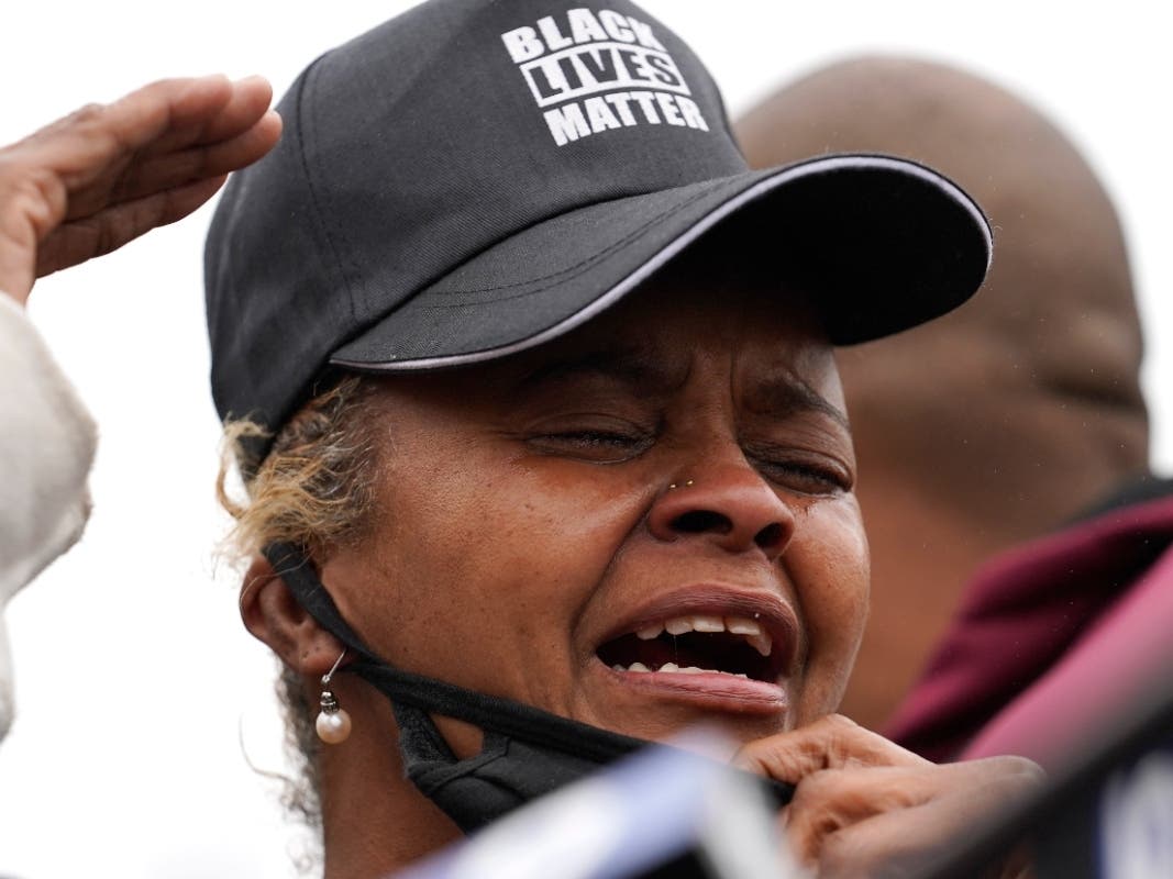Marcellis Stinnette's grandmother Sherrellis Stinnette cries as she speaks during a protest rally Thursday in Waukegan.