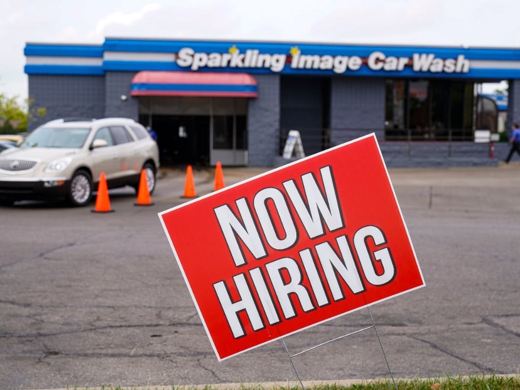 A help wanted sign is displayed at car wash in Indianapolis.