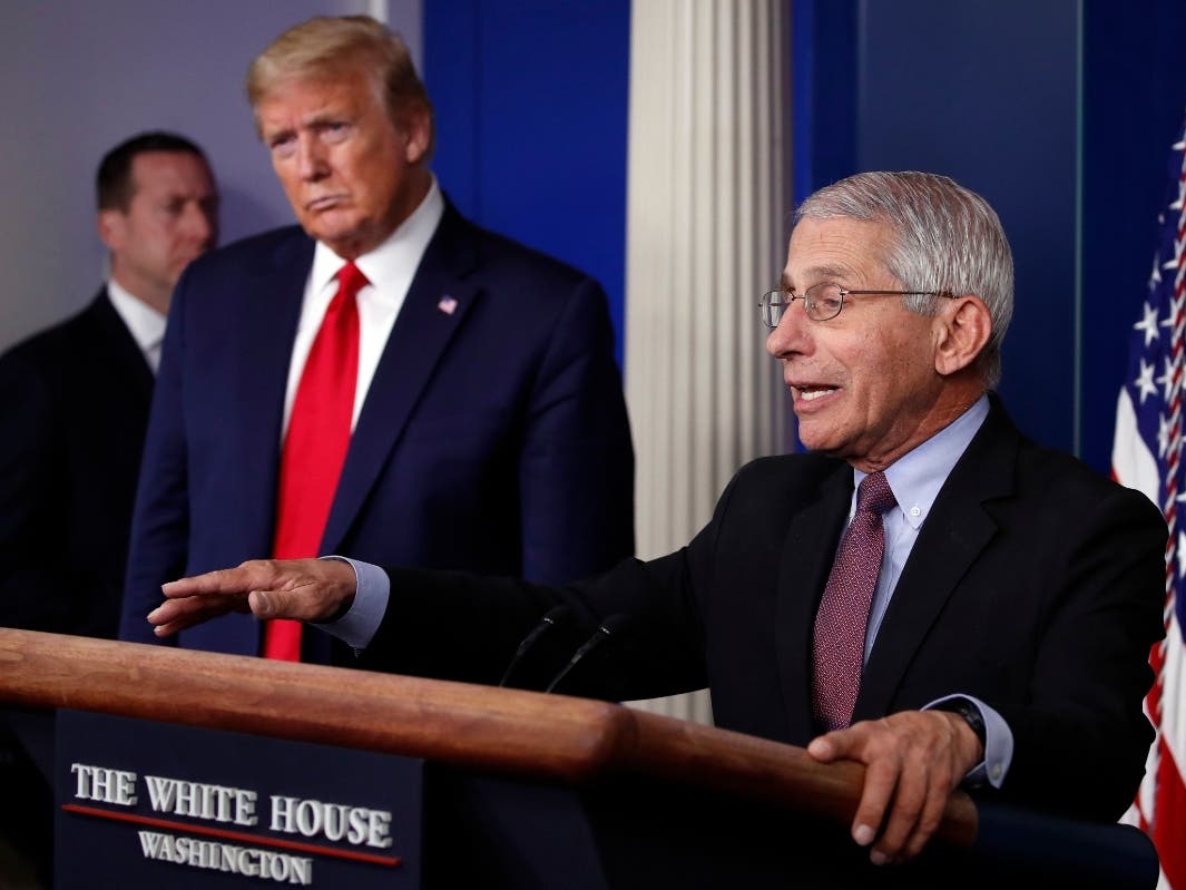 President Donald Trump listens as Dr. Anthony Fauci, director of the National Institute of Allergy and Infectious Diseases, speaks about the coronavirus.