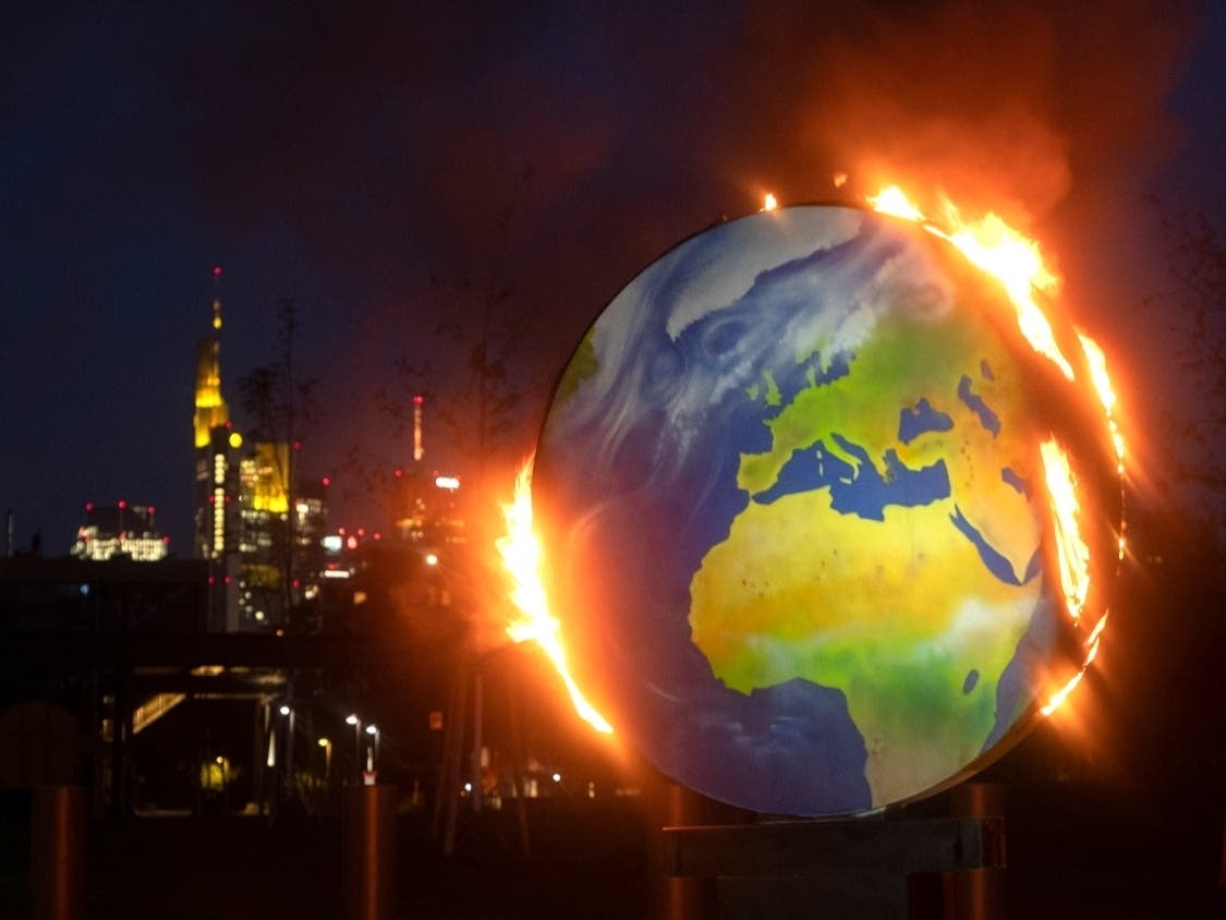 Activists of the so-called "KoalaKollektiv," an organization asking for climate justice, protested  the European Central Bank's climate policy with the burning of a makeshift globe outside the bank's headquarters in Frankfurt, Germany, on Oct. 21.