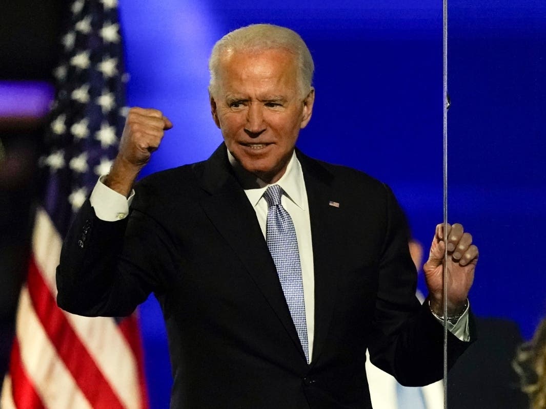 President-elect Joe Biden gestures to supporters Saturday, Nov. 7, 2020, in Wilmington, Delaware.