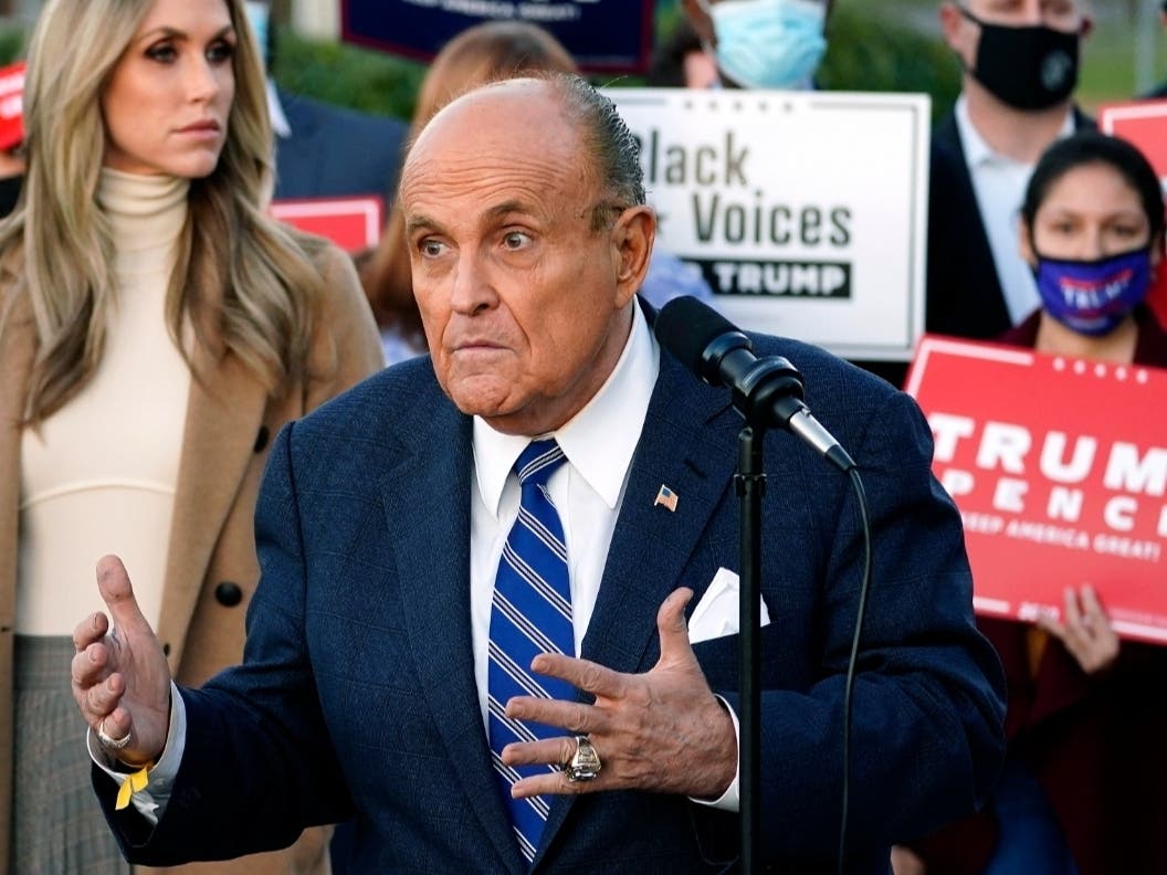 Rudy Giuliani, a lawyer for President Donald Trump, speaks during a news conference on legal challenges to vote counting in Pennsylvania Wednesday in Philadelphia. At left is Lara Trump, daughter-in-law of the president.