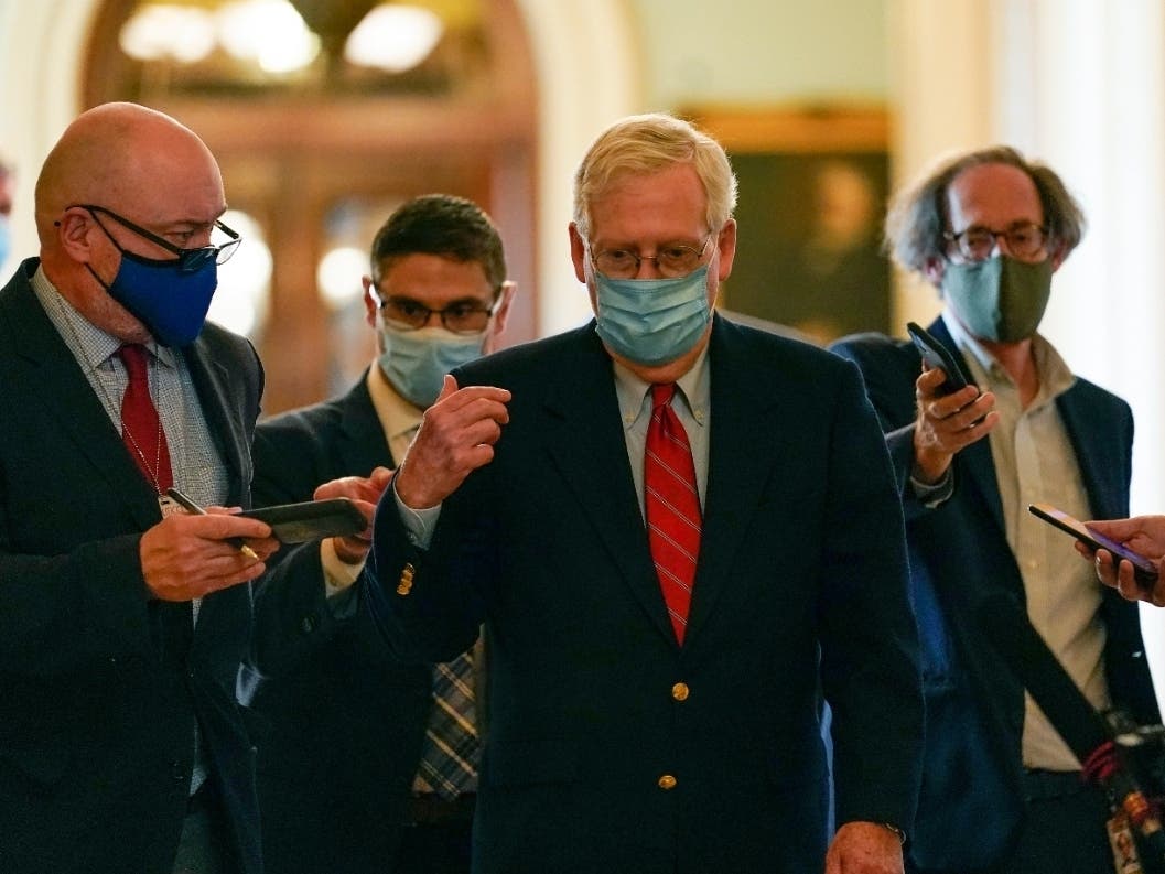 Senate Majority Leader Mitch McConnell of Ky., talks with reporters after he spoke on the Senate floor Monday.