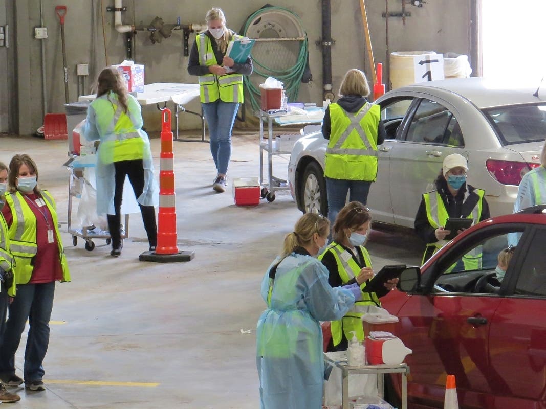 A drive-thru flu clinic in Carlton, Minnesota served as a test run for the COVID-19 vaccines that county health officials still know little about.