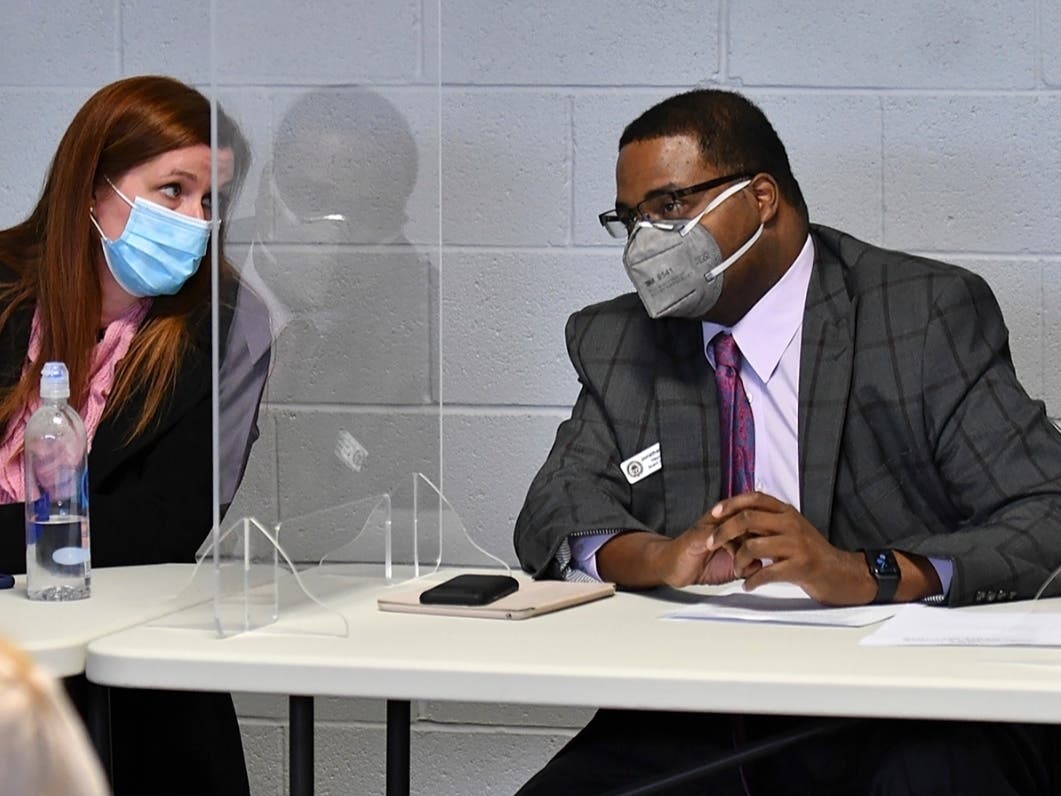 Wayne County Board of Canvassers Chair Monica Palmer, left, and Vice Chair Jonathan Kinloch  are shown after the unanimously certified election results showing Democrat Joe Biden defeating President Donald Trump. 