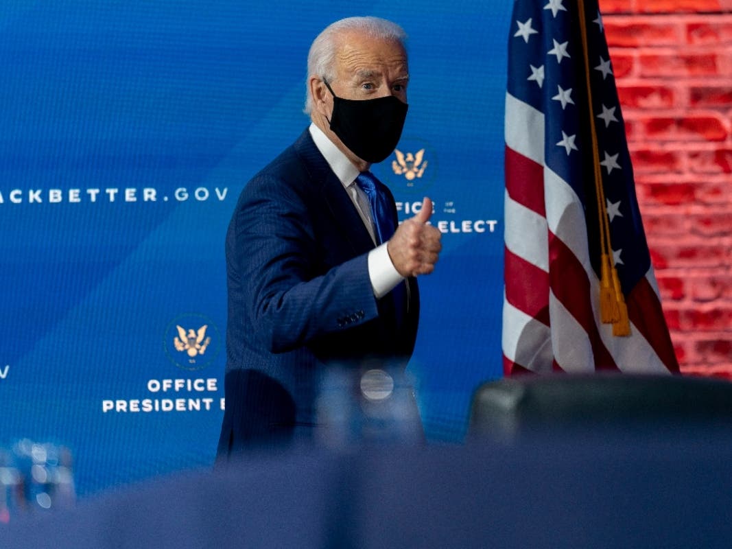 President-elect Joe Biden departs a news conference after introducing his nominees and appointees to economic policy posts at The Queen theater.