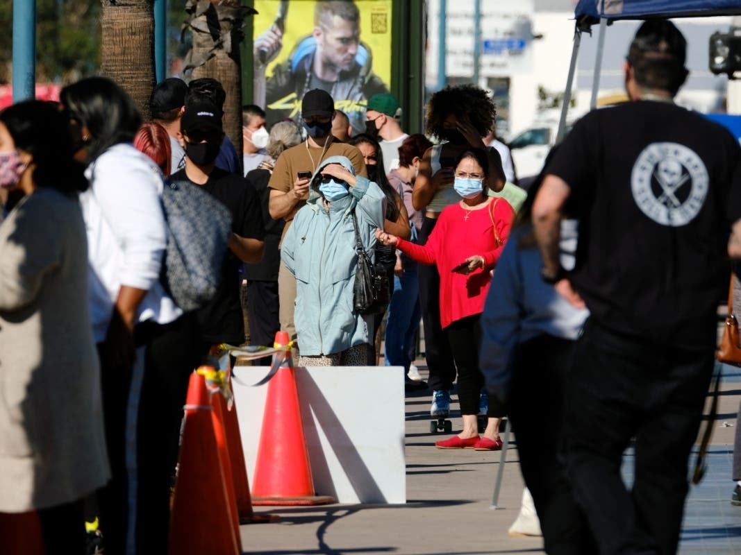 People wait in line to be tested for COVID-19 at a testing site in the North Hollywood section of Los Angeles on Saturday.
