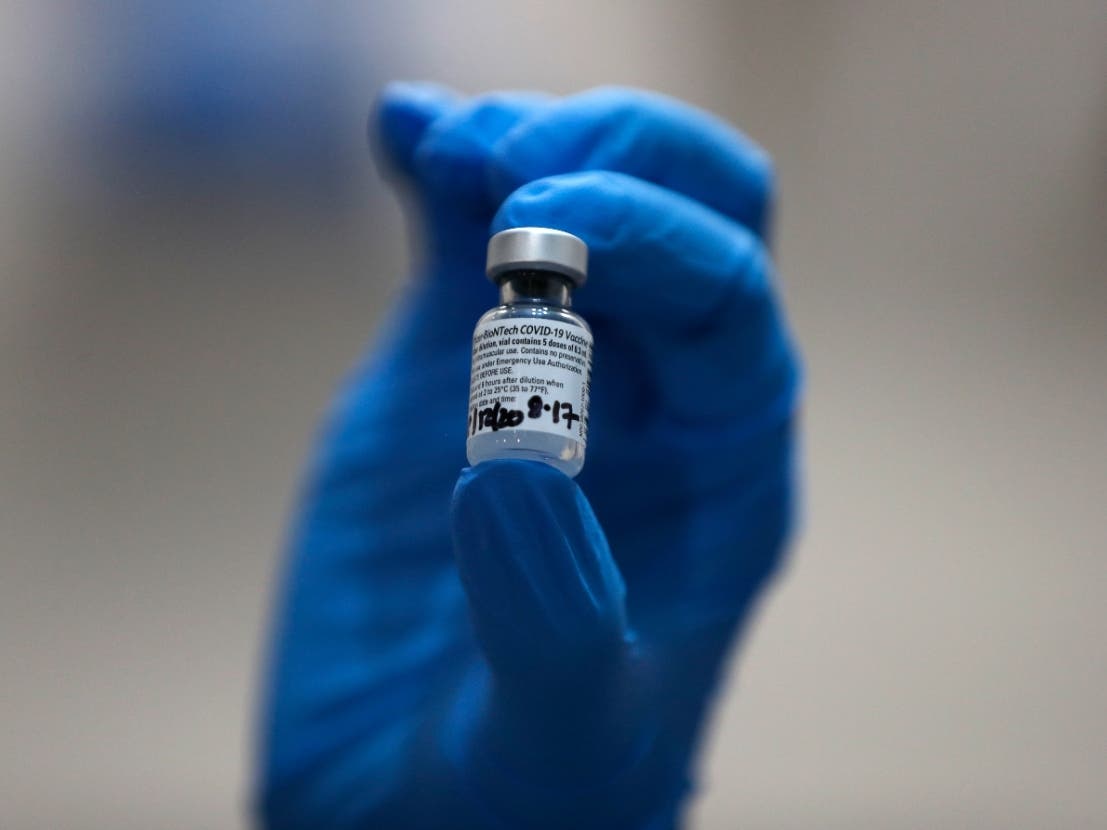 A nurse administers the Pfizer-BioNTech COVID-19 vaccine at Guy's Hospital in London. Documents released by U.S. regulators Tuesday confirmed that Pfizer's vaccine was strongly protective against COVID-19 and appeared safe.