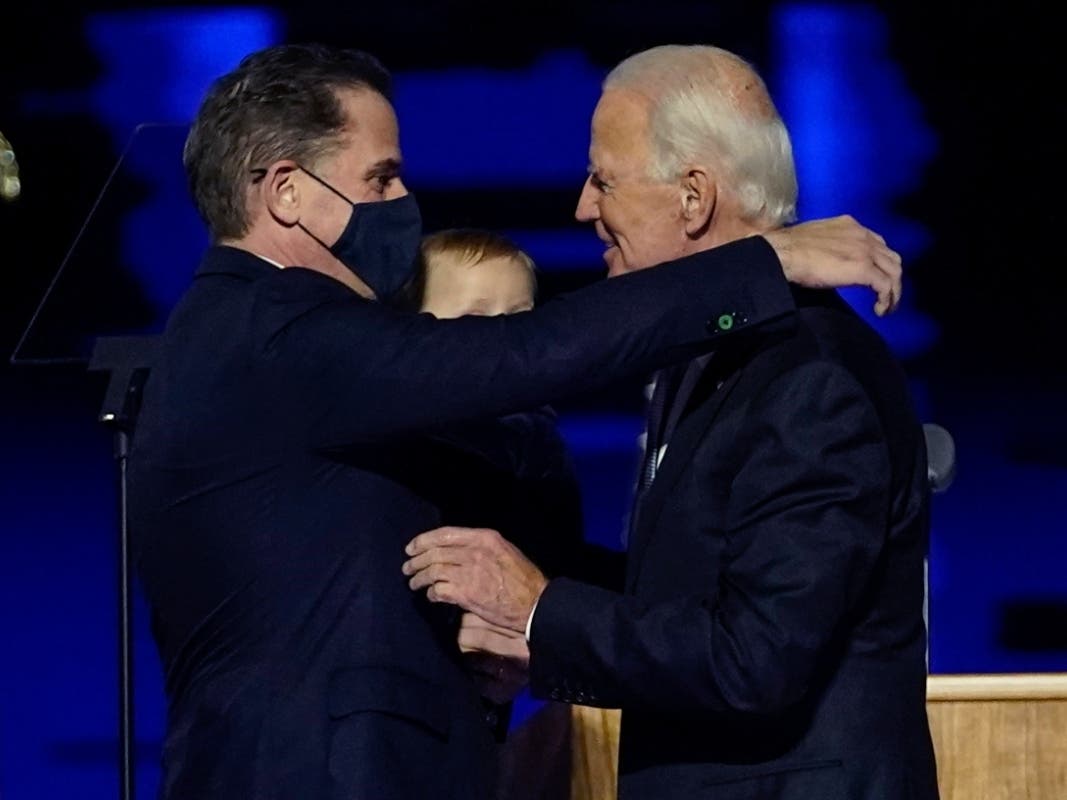 President-elect Joe Biden, right, embraces his son Hunter Biden, left, in Wilmington, Del. Biden’s son Hunter says he has learned from federal prosecutors that his tax affairs are under investigation.