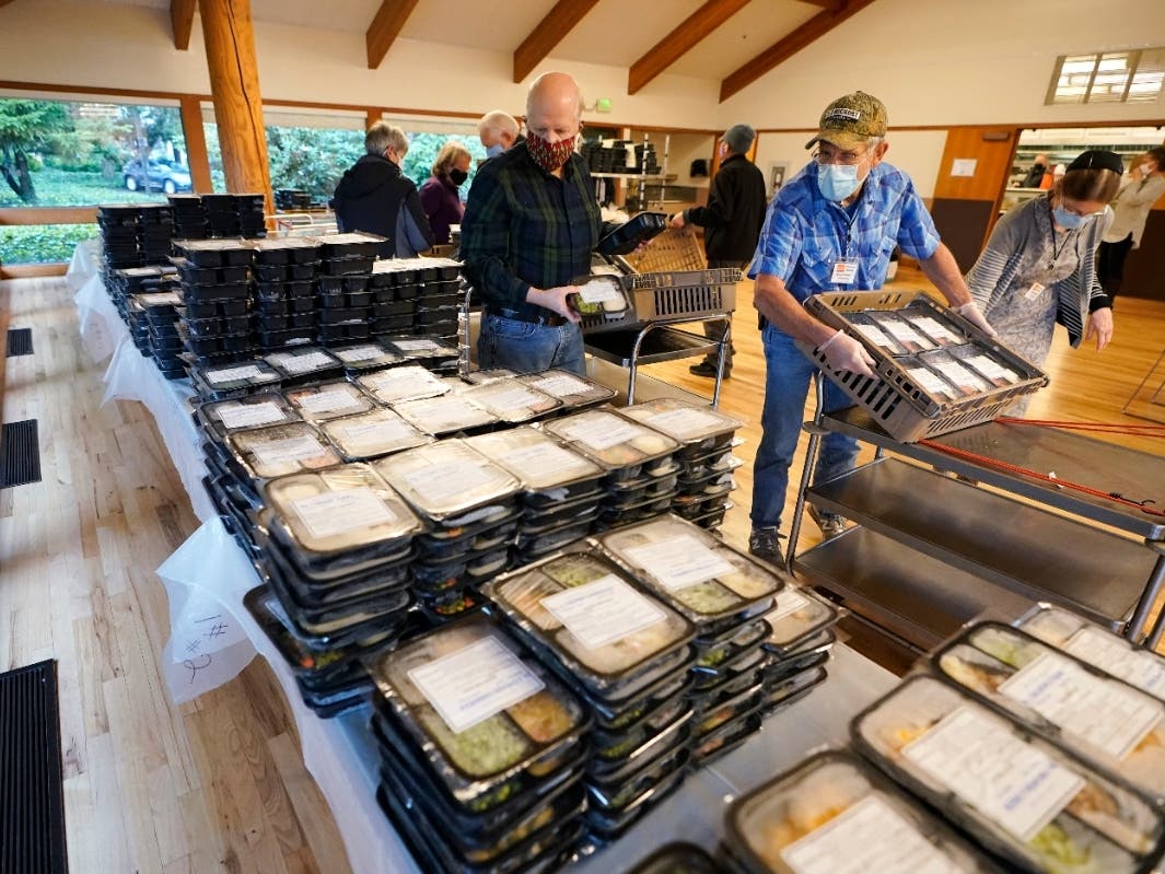 Meals on Wheels volunteers sort prepared meals prior to deliver to seniors on Dec. 9 at the Renton Senior Activity Center in Renton, Washington, south of Seattle.