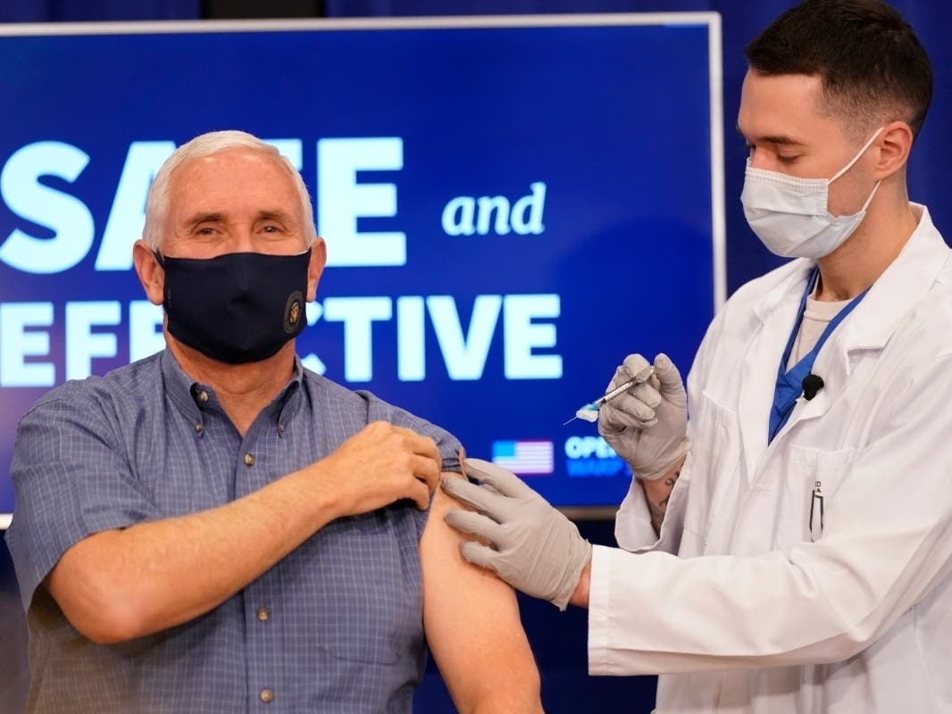 Vice President Mike Pence receives a Pfizer-BioNTech COVID-19 vaccine shot Friday morning at the Eisenhower Executive Office Building on the White House complex.