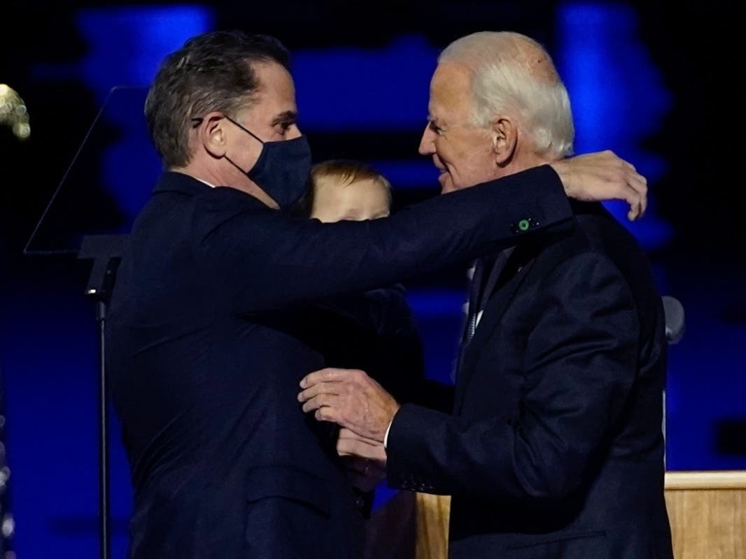 In this Nov. 7 file photo, President-elect Joe Biden, right, embraces his son Hunter Biden, left, in Wilmington, Delaware. Biden’s son Hunter says he has learned from federal prosecutors that his tax affairs are under investigation. 