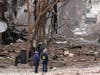 Emergency personnel work near the scene of an explosion in downtown Nashville, Tenn., on Christmas Day.