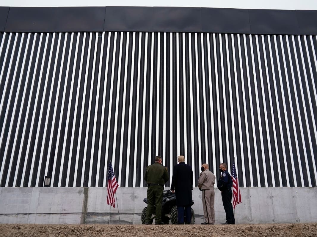 President Donald Trump tours a section of the U.S.-Mexico border wall under construction Tuesday in Alamo, Texas.